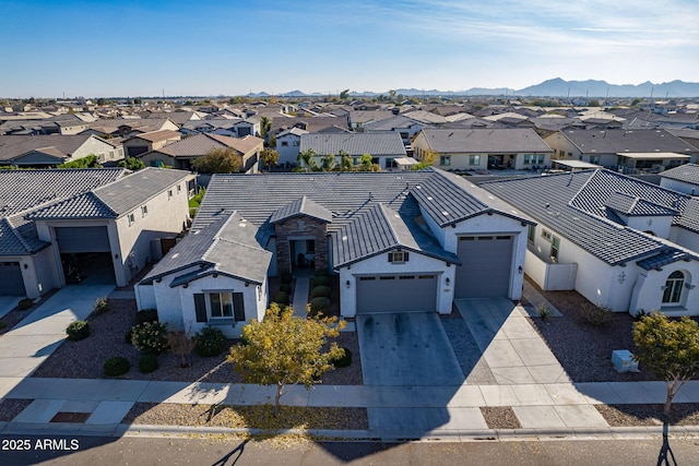 birds eye view of property with a mountain view