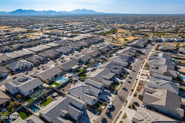 birds eye view of property featuring a mountain view