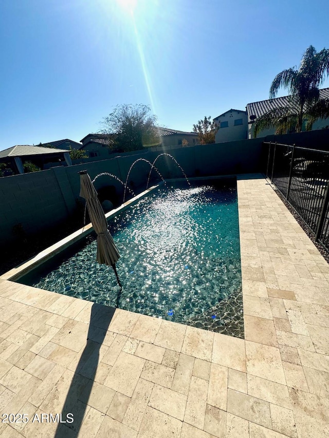 view of swimming pool featuring pool water feature