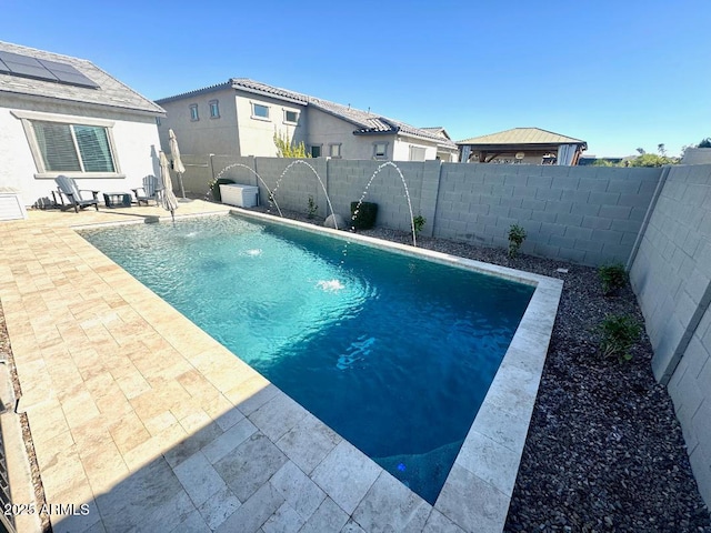 view of swimming pool featuring a patio and pool water feature