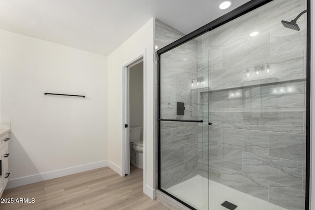 bathroom featuring a stall shower and vanity