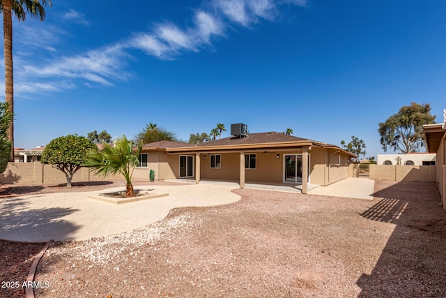 back of house featuring a patio area, a fenced backyard, and cooling unit