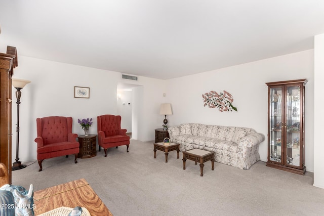 carpeted living room with visible vents