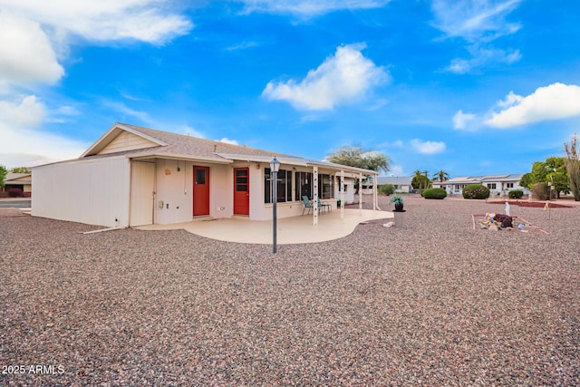 rear view of house with a patio