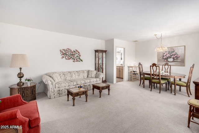 living area featuring light carpet and visible vents