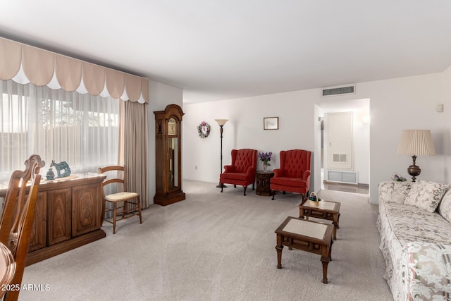 living room featuring carpet flooring and visible vents