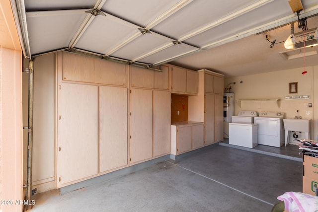 garage with a sink, washing machine and clothes dryer, electric water heater, and a garage door opener