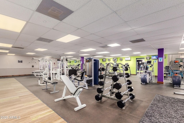 workout area featuring a paneled ceiling