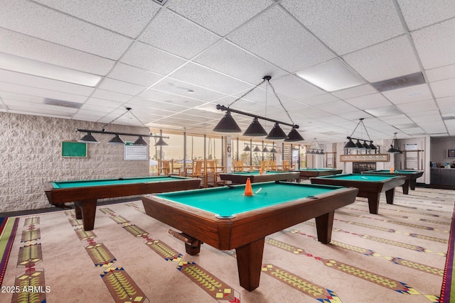 playroom with pool table, carpet flooring, and a paneled ceiling