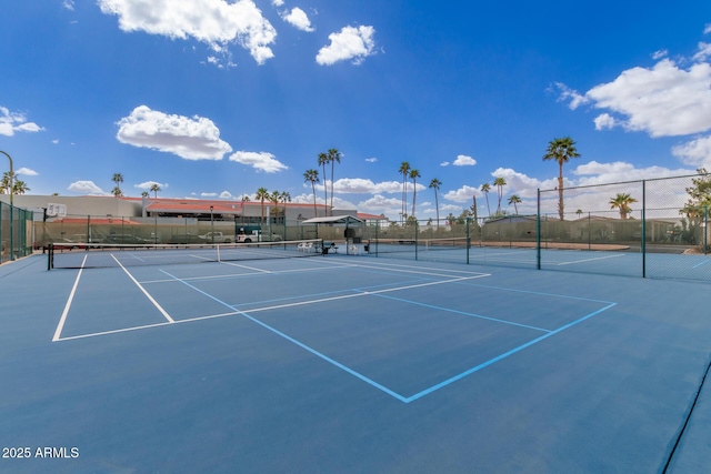 view of tennis court with fence