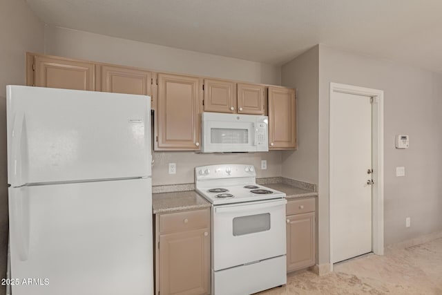 kitchen with light countertops and white appliances