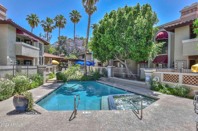 view of pool featuring a patio