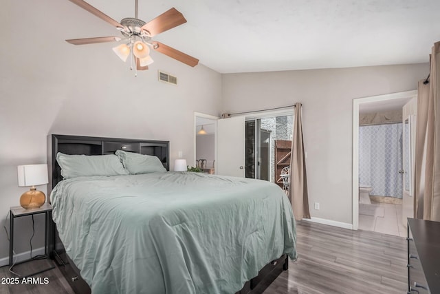 2929 E Broadway Rd Unit 30, Mesa, AZ 85204 - bedroom featuring access to exterior, wood finished floors, baseboards, ensuite bath, and vaulted ceiling