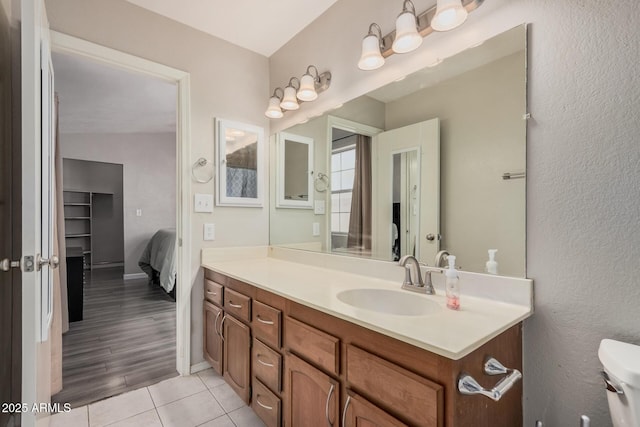 2929 E Broadway Rd Unit 30, Mesa, AZ 85204 - ensuite bathroom with vanity, toilet, tile patterned floors, and baseboards
