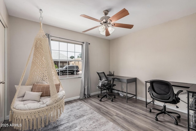 2929 E Broadway Rd Unit 30, Mesa, AZ 85204 - home office with wood finished floors, ceiling fan, and baseboards