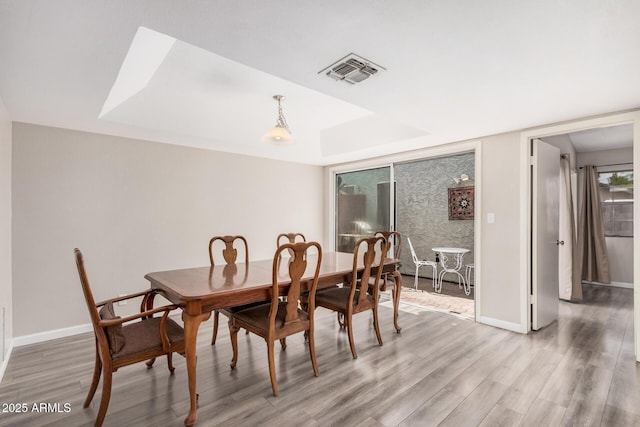 2929 E Broadway Rd Unit 30, Mesa, AZ 85204 - dining space featuring light wood-type flooring and baseboards