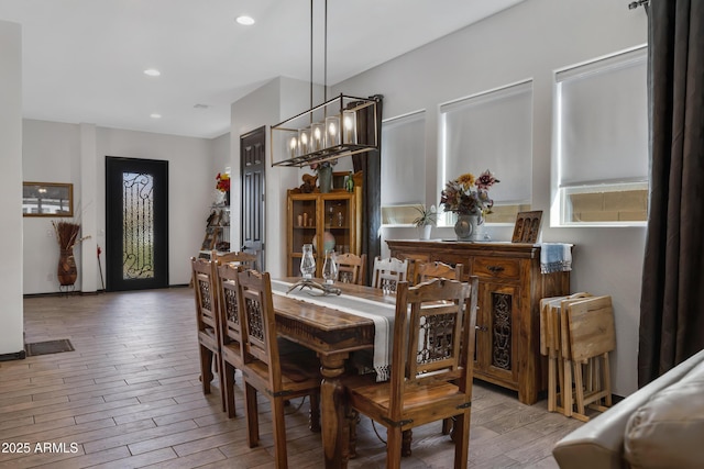 dining space with an inviting chandelier