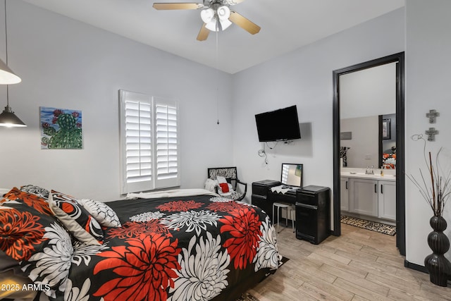 bedroom with ceiling fan, ensuite bathroom, light hardwood / wood-style flooring, and sink