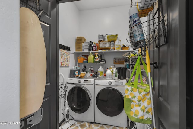 clothes washing area featuring independent washer and dryer