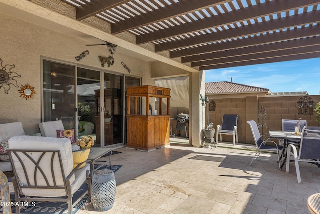 view of patio featuring ceiling fan, a pergola, and a grill