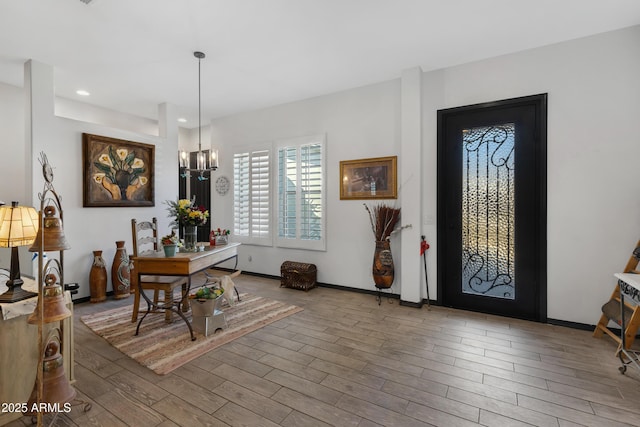 entryway with a chandelier