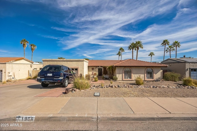 1908 E Beck Ln, Phoenix, AZ 85022 - view of front facade with concrete driveway, stucco siding, a garage, and a tiled roof