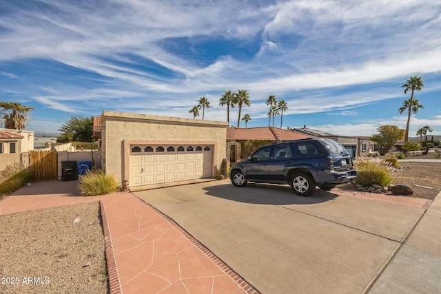 1908 E Beck Ln, Phoenix, AZ 85022 - ranch-style house with driveway, a garage, stucco siding, and fence