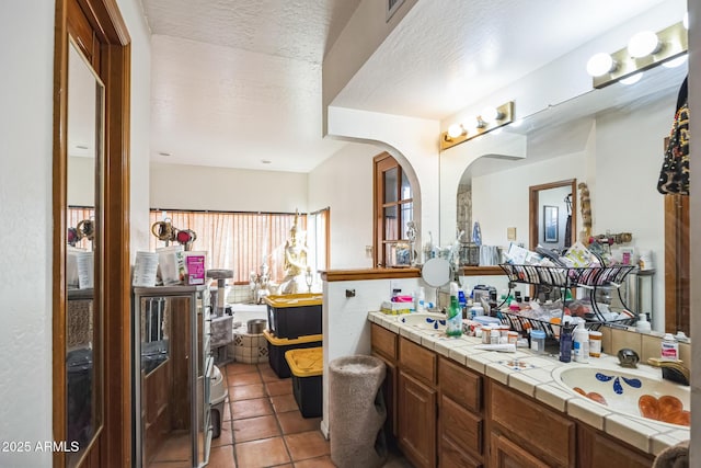 1908 E Beck Ln, Phoenix, AZ 85022 - bathroom with tile patterned floors, a textured ceiling, and double vanity