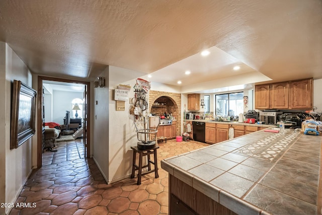 1908 E Beck Ln, Phoenix, AZ 85022 - kitchen featuring dishwasher, baseboards, recessed lighting, a textured ceiling, and tile counters