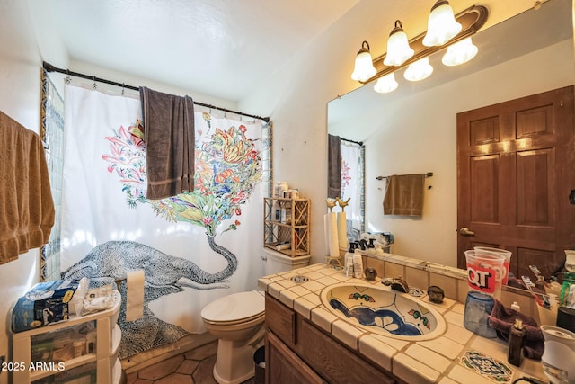 1908 E Beck Ln, Phoenix, AZ 85022 - full bathroom featuring toilet, vanity, and tile patterned flooring