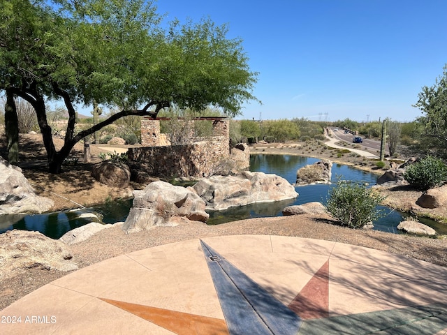 view of community with a water view