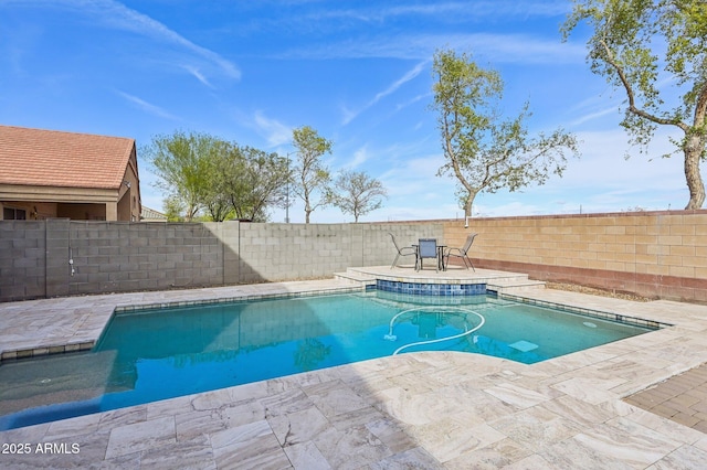 view of swimming pool with a patio area, a fenced in pool, and a fenced backyard