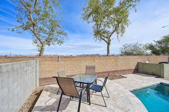 view of patio / terrace featuring a fenced backyard and outdoor dining space