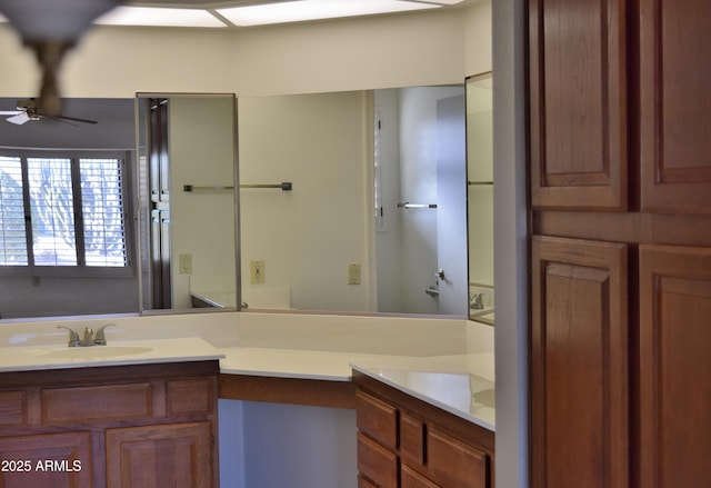 bathroom with ceiling fan and vanity