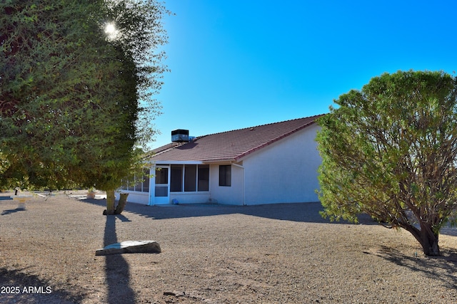 view of front of house featuring a sunroom