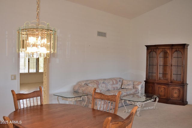 dining area featuring a chandelier