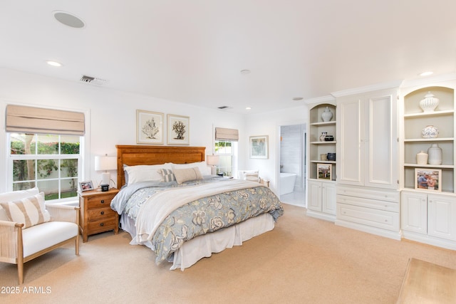 bedroom featuring recessed lighting, visible vents, light colored carpet, and connected bathroom