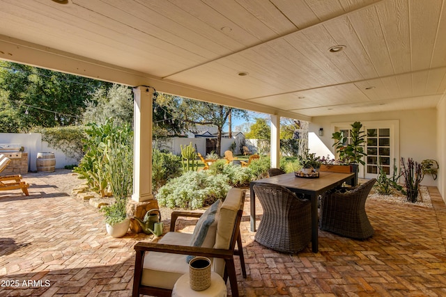 view of patio featuring outdoor dining space and a fenced backyard