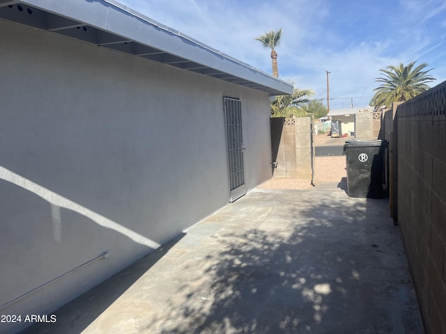 view of side of home with a patio