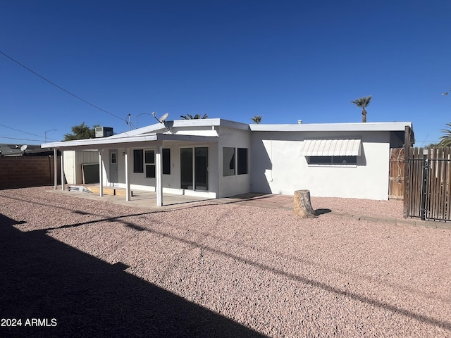 back of property with a patio area