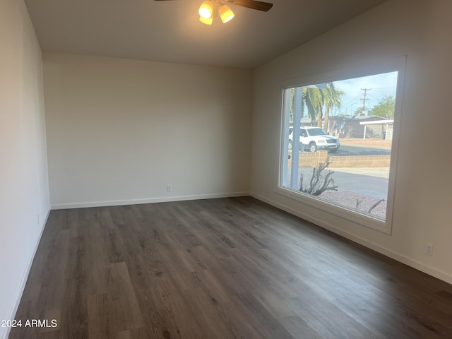 unfurnished room with dark hardwood / wood-style floors, ceiling fan, and lofted ceiling