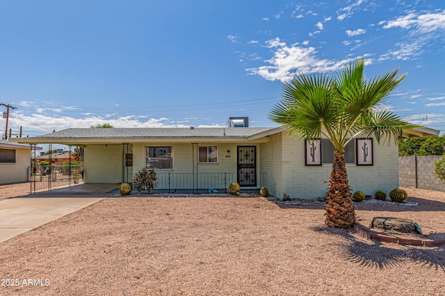 5309 E Butte St, Mesa, AZ 85205 - ranch-style home featuring driveway, a carport, and covered porch