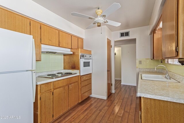 5309 E Butte St, Mesa, AZ 85205 - kitchen featuring white appliances, under cabinet range hood, light countertops, tasteful backsplash, and ceiling fan