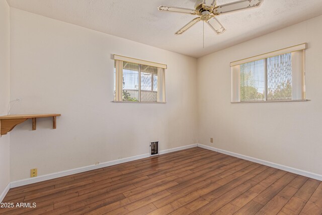 5309 E Butte St, Mesa, AZ 85205 - spare room featuring wood finished floors and ceiling fan