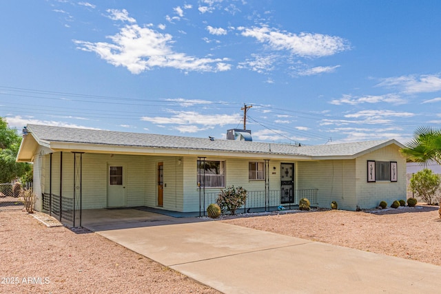 5309 E Butte St, Mesa, AZ 85205 - single story home featuring concrete driveway, an attached carport, a porch, and brick siding