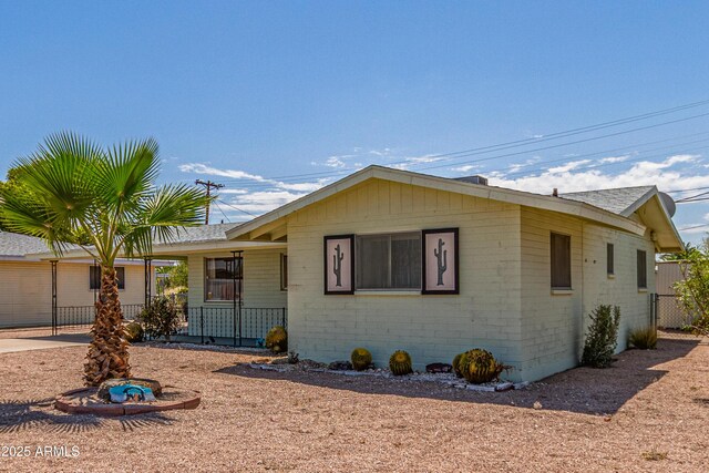5309 E Butte St, Mesa, AZ 85205 - ranch-style home with roof with shingles and a porch
