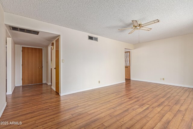 5309 E Butte St, Mesa, AZ 85205 - spare room featuring a textured ceiling, a ceiling fan, and wood finished floors