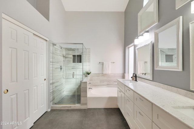 bathroom featuring vanity, tile patterned floors, and independent shower and bath