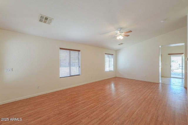 unfurnished room with ceiling fan and light hardwood / wood-style floors