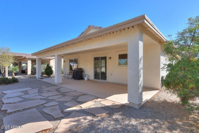 back of property with a patio area